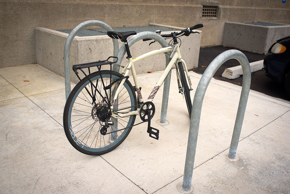 SLCC bicycle registry gains traction White bike locked to rack