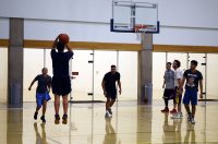 Play pickup basketball at the LAC Taking a jump shot