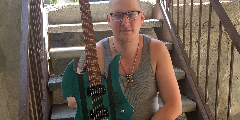 SLCC offers some cool classes Sean Cuny with his guitar