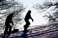 5 fun ways to stay active this winter Tobogganers walking uphill
