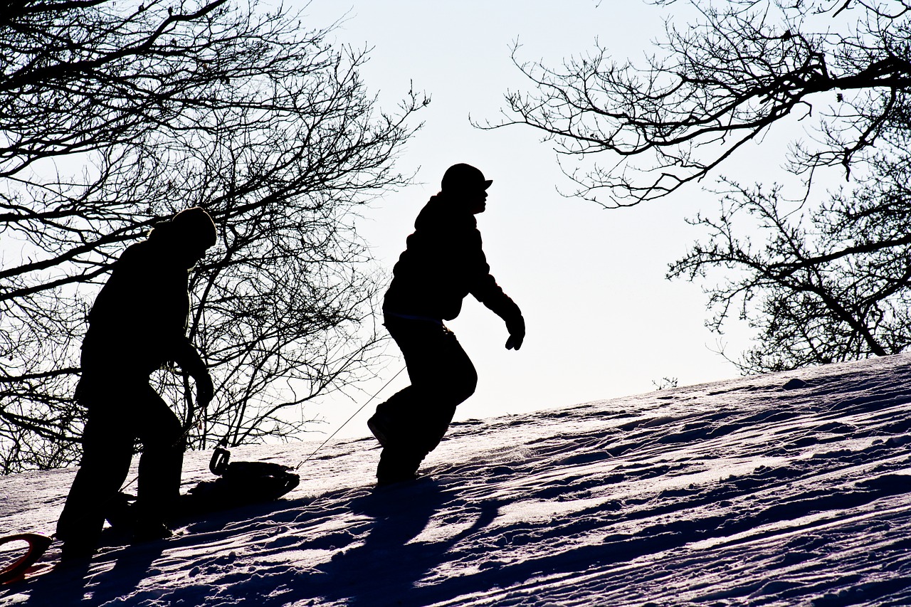 5 fun ways to stay active this winter Tobogganers walking uphill