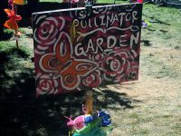 Butterfly sign with the words "pollinator garden"