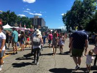 Festivalgoers walk down the street