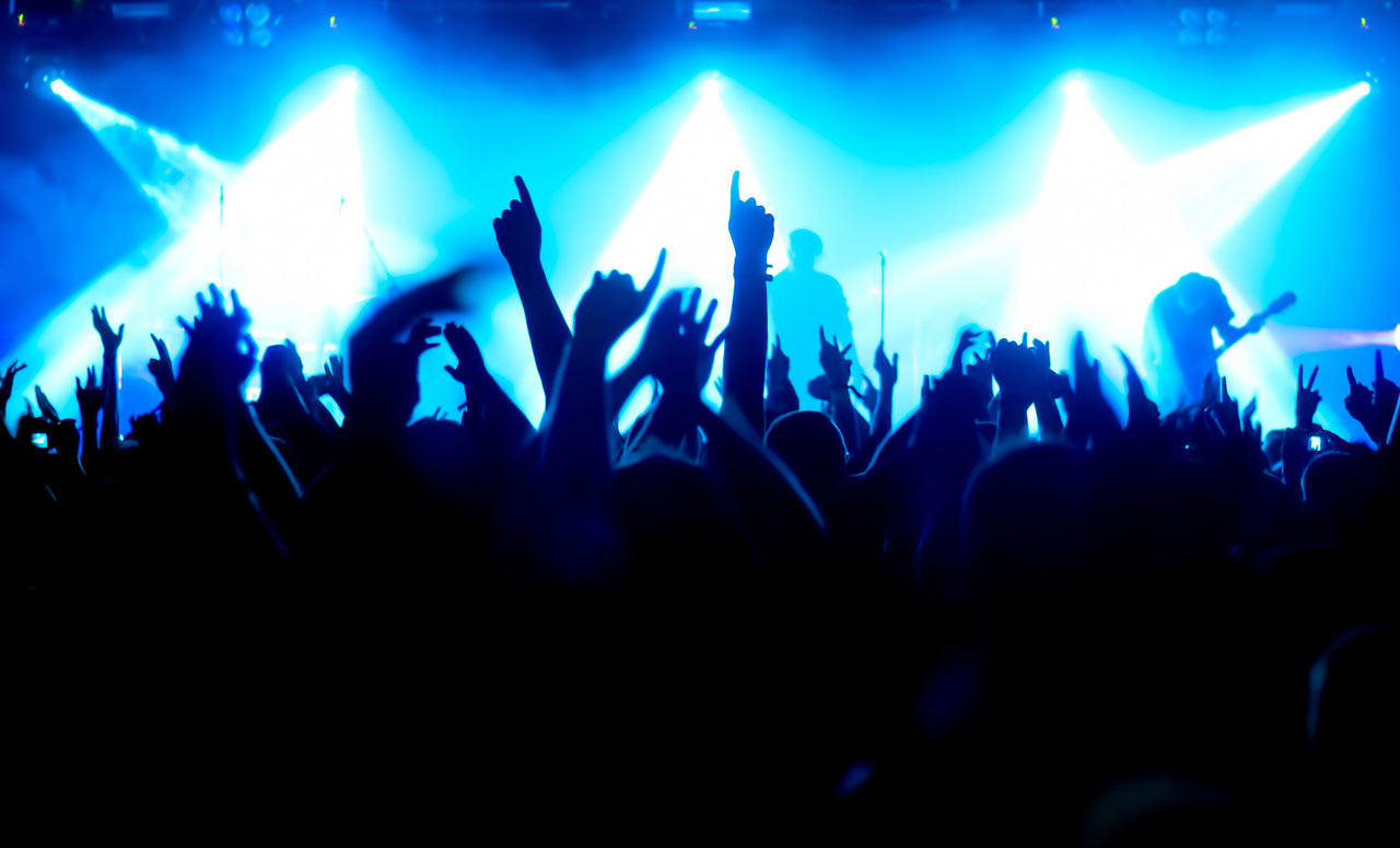 Salt City Sounds features a bonanza of artists Silhouettes of concert crowd in front of bright stage lights