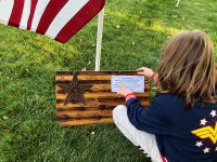 Young girl reads a note