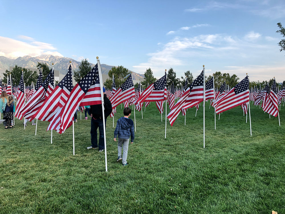 Photos: 18th annual Utah Healing Field Adult and young child surrounded by American flags