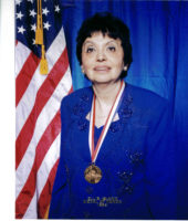 Inge Auerbacher wears her Ellis Island Medal of Honor