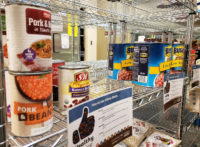 Canned beans on a pantry rack