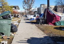 Amid shelter closing, SLCC amps up support of basic needs Tents line a city sidewalk