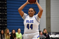 Leichan Williams holds the ball over her head
