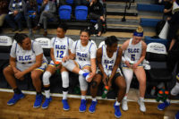 Bruin players rest on bench