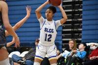 Fatoumata Jallow holds the ball over her head