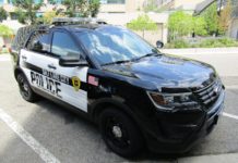 The complicated relationship between SLCPD and the homeless Salt Lake City Police vehicle parked downtown