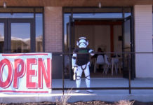 Watchtower Coffee and Comics moves into new digs Storm trooper in front of Watchtower cafe