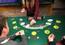 SLCC Student Association treats Bruins to Mardi Gras celebration Dealing blackjack