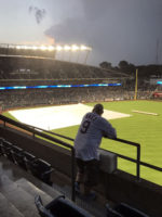 Brian leans on railing during rain delay