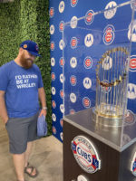 Brian admires World Series trophy behind glass