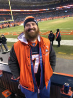 Sports and competition: A missing distraction Brian wears Denver Broncos gear