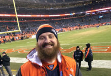 Sports and competition: A missing distraction Brian wears Denver Broncos gear