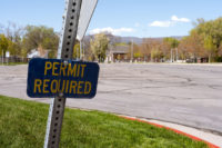 Permit required sign in front of empty parking lot