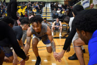 Justice Hill races to Murray State after ‘incredible’ season at SLCC Justice Hill slaps hands with teammates