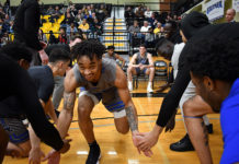 Justice Hill races to Murray State after ‘incredible’ season at SLCC Justice Hill slaps hands with teammates