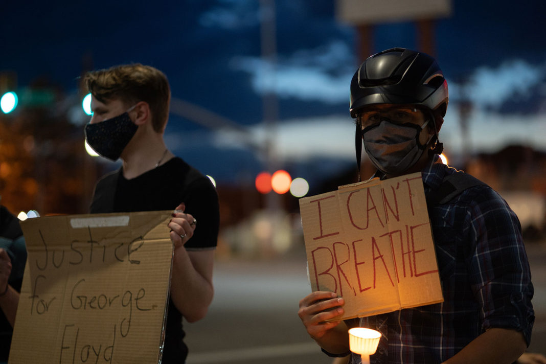 Signs read "I can't breathe" and "Justice for George Floyd"