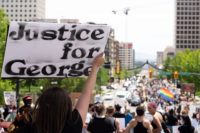 2020: A year in review Sign reads "Justice for George"