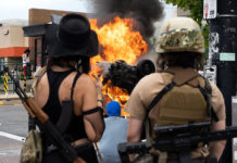 Photos: Thousands protest in Salt Lake City over death of George Floyd Protesters watch burning car