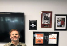 Aaron Meier of Complete Recovery Corporation: ‘It’s tough to run a business’ Aaron Meier stands next to wall of achievement