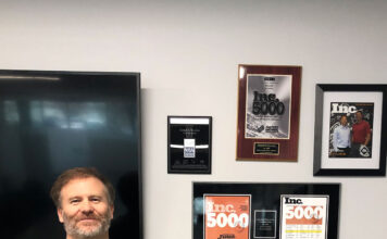 Aaron Meier of Complete Recovery Corporation: ‘It’s tough to run a business’ Aaron Meier stands next to wall of achievement