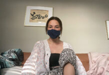 SLCC students use virtual technology, prioritize social distancing Emily wearing a dark blue face mask