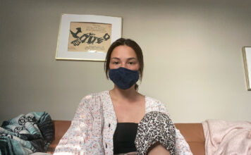 SLCC students use virtual technology, prioritize social distancing Emily wearing a dark blue face mask