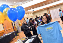SLCC to join first-generation student celebrations Female students miles with her I'm the First t-shirt