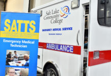 Relief program offers training to Utahns in need SATTS banner next to SLCC training ambulance