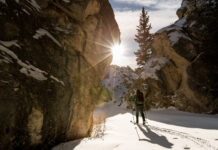 Pandemic challenge: Staying active this winter Man cross country skiing in snowy mountain