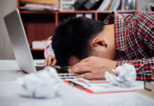 What to do if you fail a class Unhappy man with head down on laptop