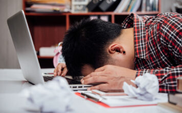 What to do if you fail a class Unhappy man with head down on laptop