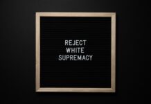 No More Silence: Black Student Union speaks for change Chalkboard reads "reject white supremacy"