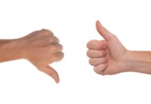 Students weigh benefits of using Rate My Professors One hand giving thumbs down, other hand giving thumbs up