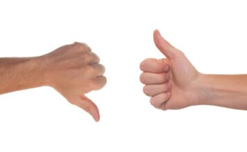 Students weigh benefits of using Rate My Professors One hand giving thumbs down, other hand giving thumbs up