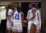 Bruins prepare for Region 18 basketball tournaments Bruin players huddle to talk