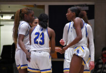 Bruins prepare for Region 18 basketball tournaments Bruin players huddle to talk