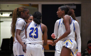 Bruins prepare for Region 18 basketball tournaments Bruin players huddle to talk