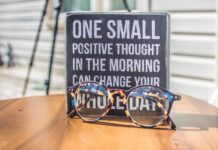 Mental health: Small changes can make a big difference Glasses with sign that reads "One small positive thought in the morning can change your whole day"