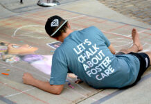 Photos: Let’s chalk about foster care Kam wears shirt that reads "Let's chalk about foster care"