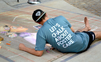 Photos: Let’s chalk about foster care Kam wears shirt that reads "Let's chalk about foster care"
