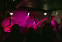 Squid Picnic headlines Kilby Court’s first full-capacity show in 2021 Three band members play guitar in front of live audience