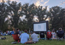 Sundance Institute initiatives continue in 2021 Dozens of people sit outside to watch a movie