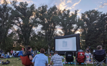Sundance Institute initiatives continue in 2021 Dozens of people sit outside to watch a movie
